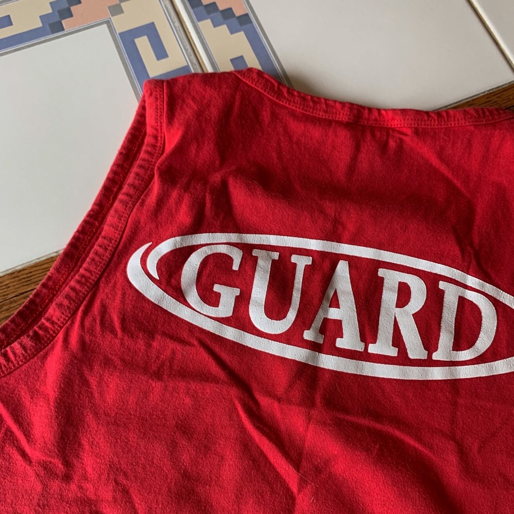 𝗗𝗢𝗡𝗔𝗧𝗘𝗗 Lifeguard Cropped Raw Hem Muscle Te